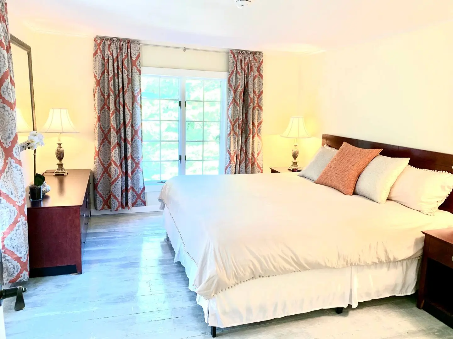Bedroom with a king-size bed and patio doors